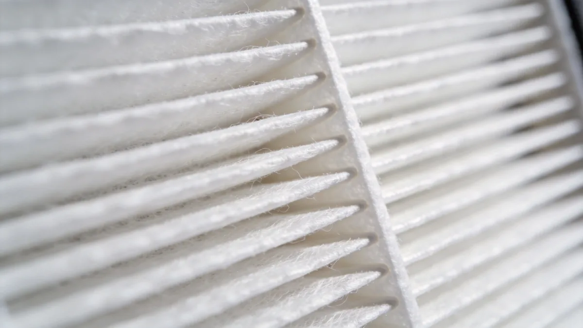 Folded pleated HEPA filter element with dense white micro-glass media